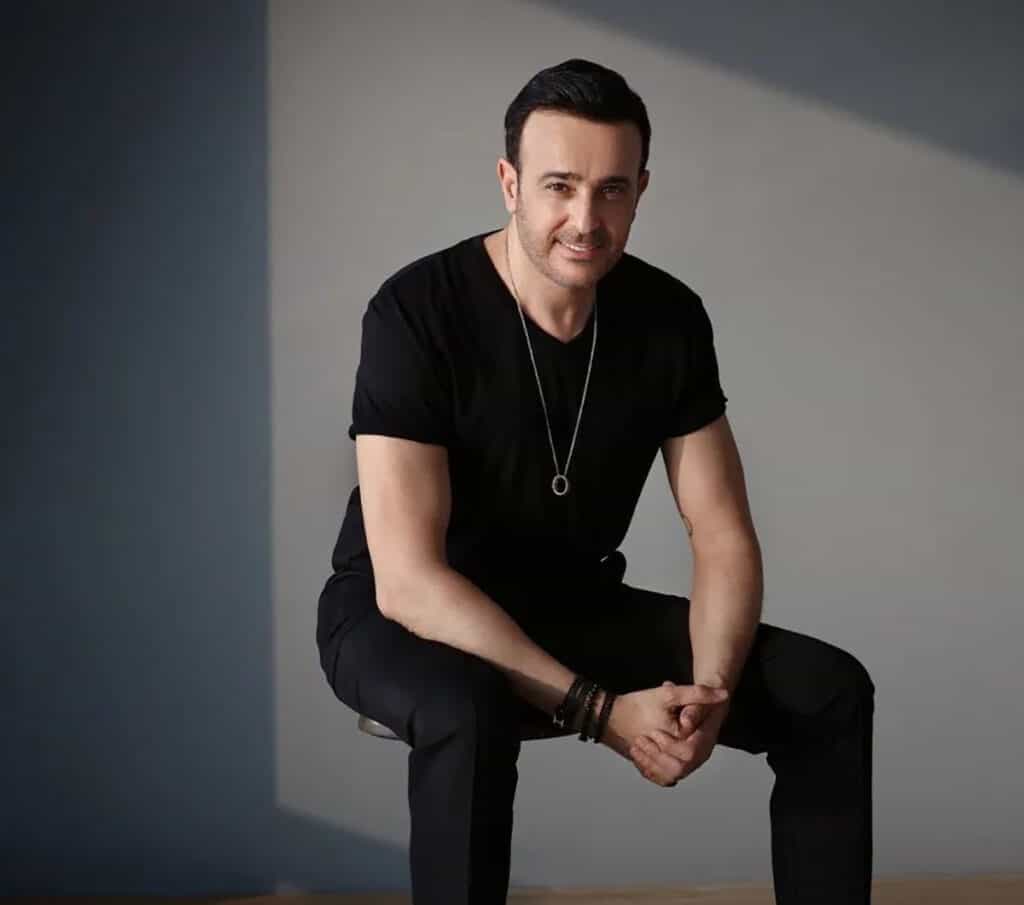 The person in the image is Saber Rebai, a Tunisian singer, actor, and composer. He is known for his popular song "Sidi Mansour".