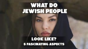 A group of Jewish people in a social setting, possibly in a cultural or religious gathering, dressed in traditional or modern attire, engaging in conversation or celebration.