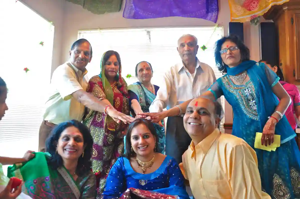 The bride and groom receiving blessings from the elders during the Aashirwad ceremony in a traditional Bengali wedding. The bride and groom receiving blessings from the elders during the Aashirwad ceremony in a traditional Bengali wedding.