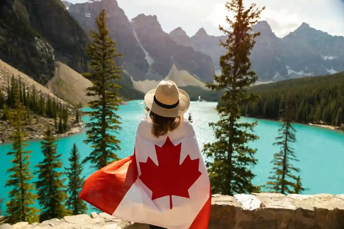 Woman Draped In A Flag Of Canada Woman Draped In A Flag Of Canada