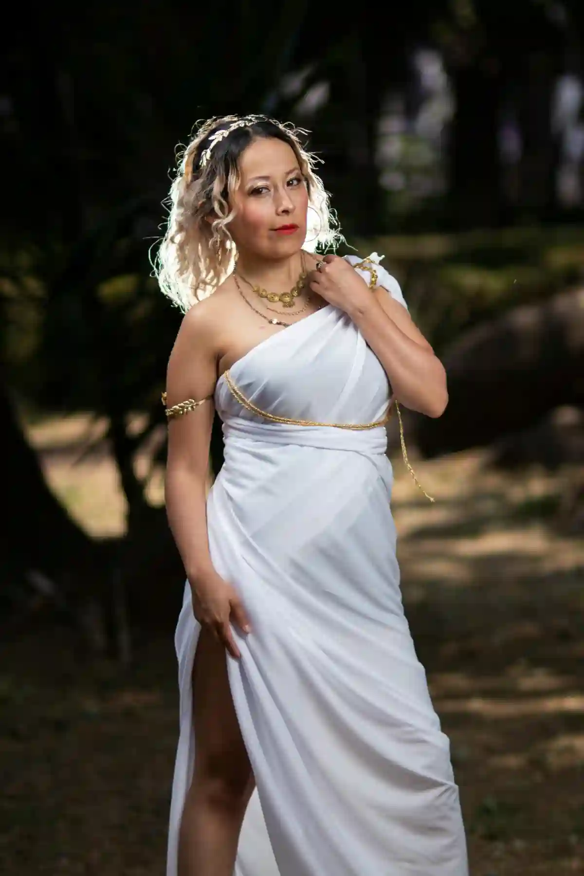 Elegant Woman in White Grecian Dress, standing gracefully outdoors, embodying the timeless beauty and serenity of ancient Greek goddesses. Elegant Woman in White Grecian Dress, standing gracefully outdoors, embodying the timeless beauty and serenity of ancient Greek goddesses.