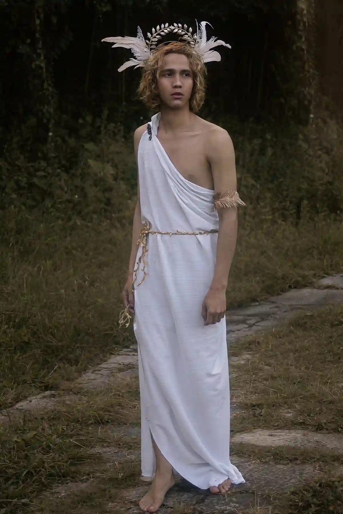 Man in White Toga, dressed as a Greek god, exuding authority and grace, standing confidently in a classical pose. Man in White Toga, dressed as a Greek god, exuding authority and grace, standing confidently in a classical pose.