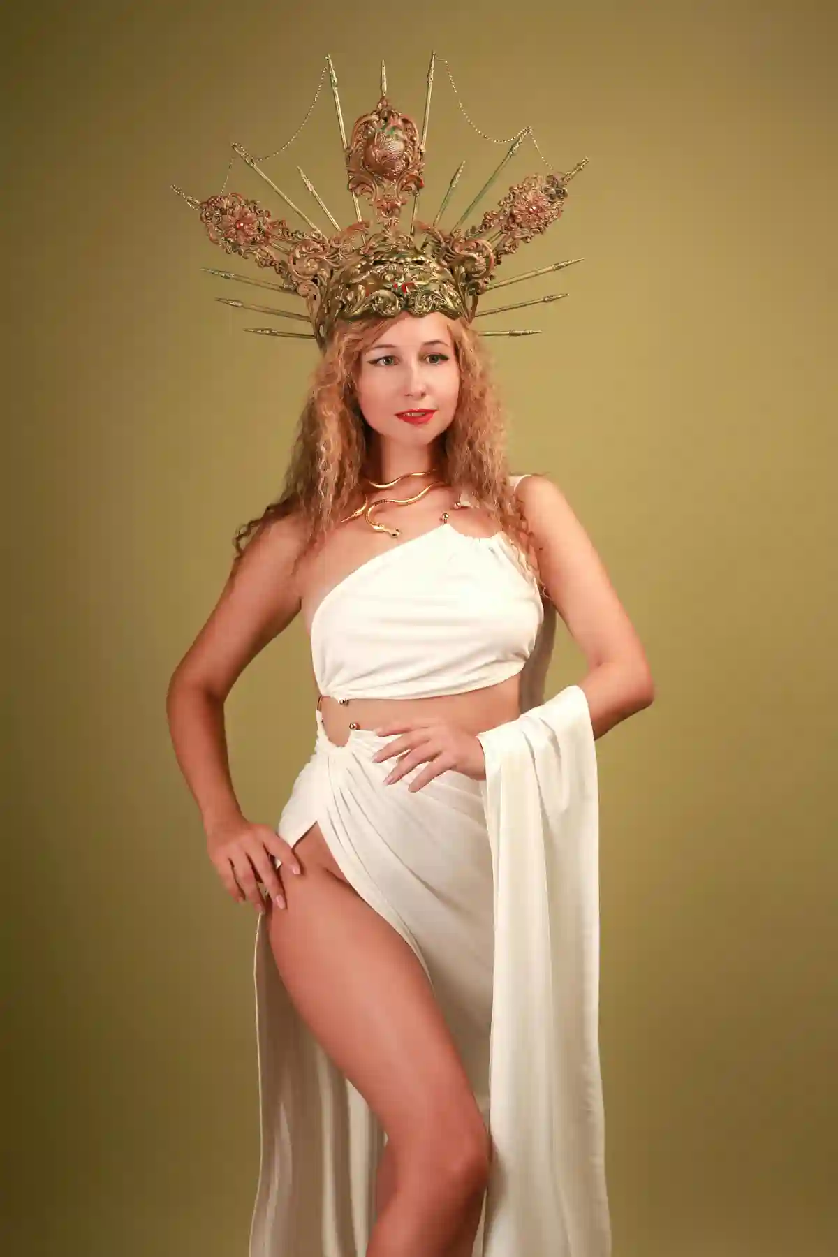 Studio Shot of a Woman Wearing a Goddess Costume, adorned with an intricate headdress, exuding elegance and divine grace reminiscent of ancient Greek mythology. Studio Shot of a Woman Wearing a Goddess Costume, adorned with an intricate headdress, exuding elegance and divine grace reminiscent of ancient Greek mythology.
