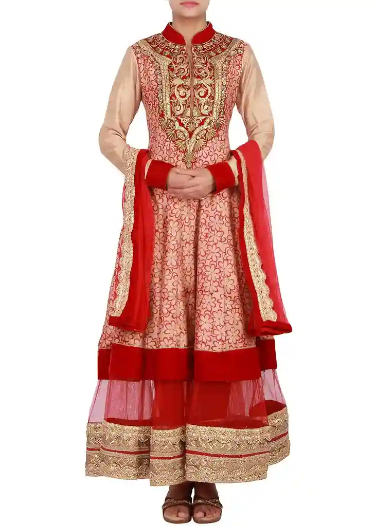 A woman in a vibrant red Kalki dress, featuring intricate embroidery and luxurious fabric, perfect for weddings and festive occasions. A woman in a vibrant red Kalki dress, featuring intricate embroidery and luxurious fabric, perfect for weddings and festive occasions.