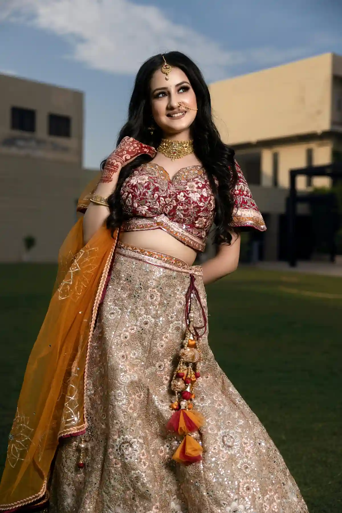 A woman smiling while wearing traditional clothing, embodying cultural pride and elegance with a warm and welcoming expression. A woman smiling while wearing traditional clothing, embodying cultural pride and elegance with a warm and welcoming expression.