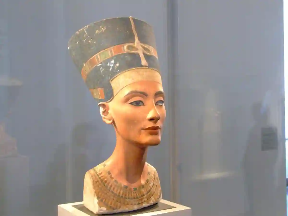 The famous Nefertiti Bust, one of the most renowned statues in the world, showcasing the elegance and beauty of the ancient Egyptian queen. The famous Nefertiti Bust, one of the most renowned statues in the world, showcasing the elegance and beauty of the ancient Egyptian queen.