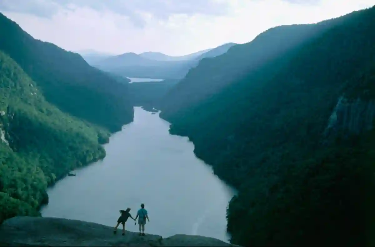 The towering peaks of the Adirondack Mountains, with lush forests and clear skies, offering a perfect hiking and nature escape in New York. The towering peaks of the Adirondack Mountains, with lush forests and clear skies, offering a perfect hiking and nature escape in New York.