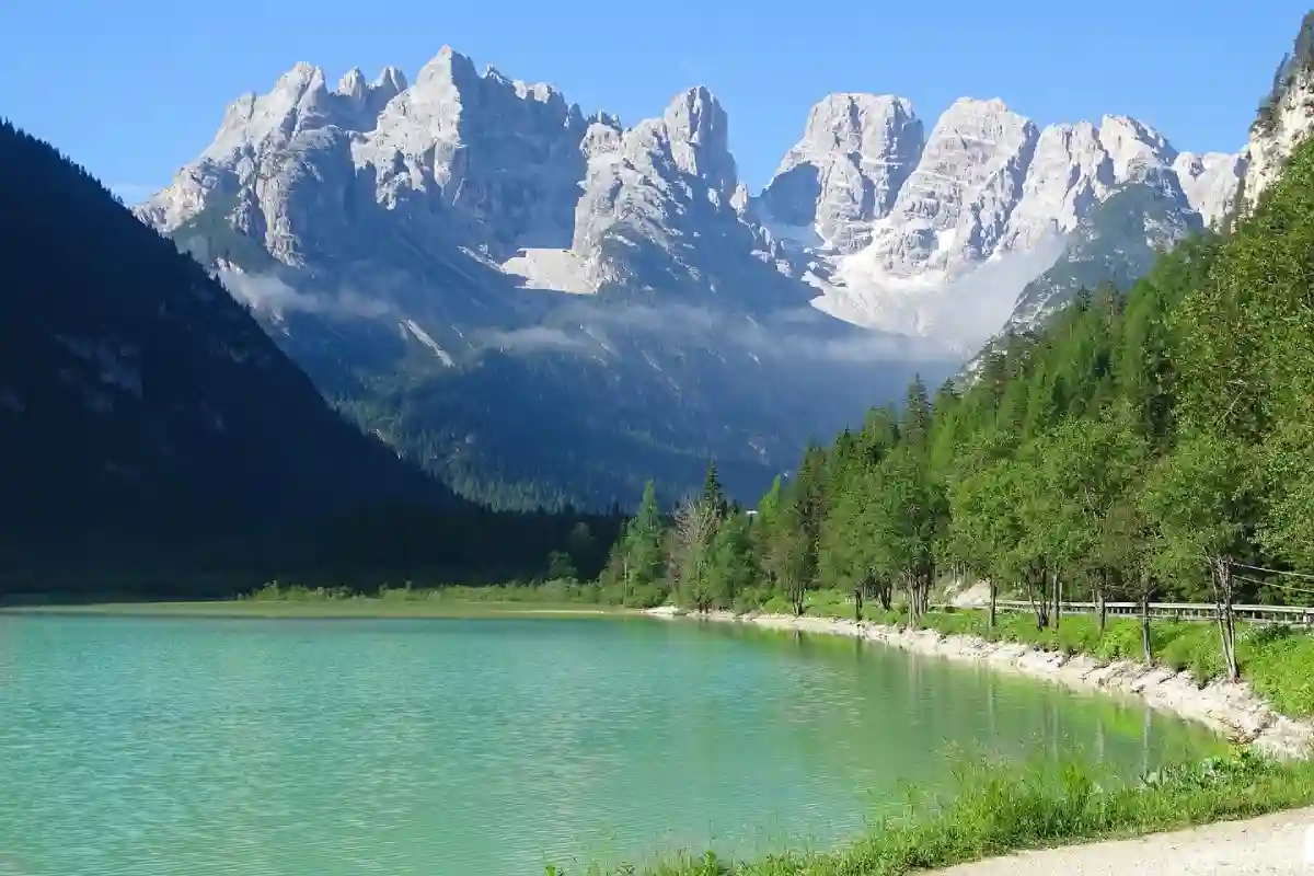 Breathtaking view of the Dolomites mountains surrounding the tranquil waters of Lake Landro, a hidden gem in Northern Italy. Breathtaking view of the Dolomites mountains surrounding the tranquil waters of Lake Landro, a hidden gem in Northern Italy.