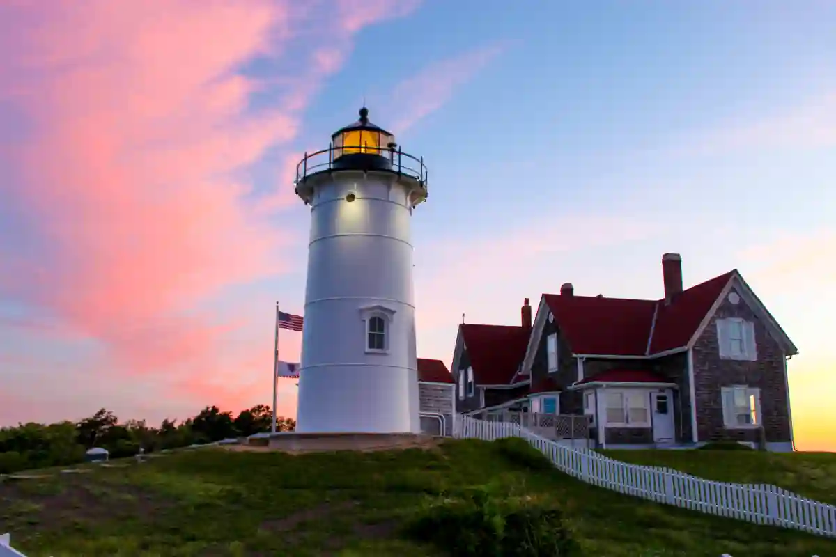 Nobska Lighthouse perched on a hill with stunning views of Cape Cod’s coastline and the Atlantic Ocean on a bright summer day Nobska Lighthouse perched on a hill with stunning views of Cape Cod’s coastline and the Atlantic Ocean on a bright summer day