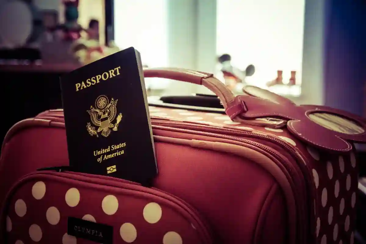 Travel tips for first-time flyers, featuring a passport placed on top of luggage as part of pre-flight preparation. Travel tips for first-time flyers, featuring a passport placed on top of luggage as part of pre-flight preparation.