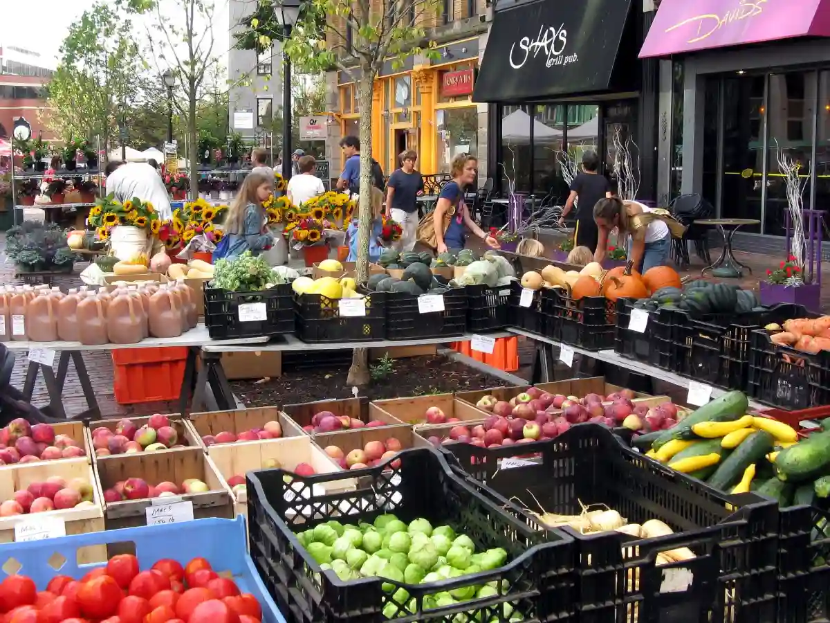 Stalls at the Portland Farmers' Market filled with fresh produce, local meats, and handmade goods. Stalls at the Portland Farmers' Market filled with fresh produce, local meats, and handmade goods.