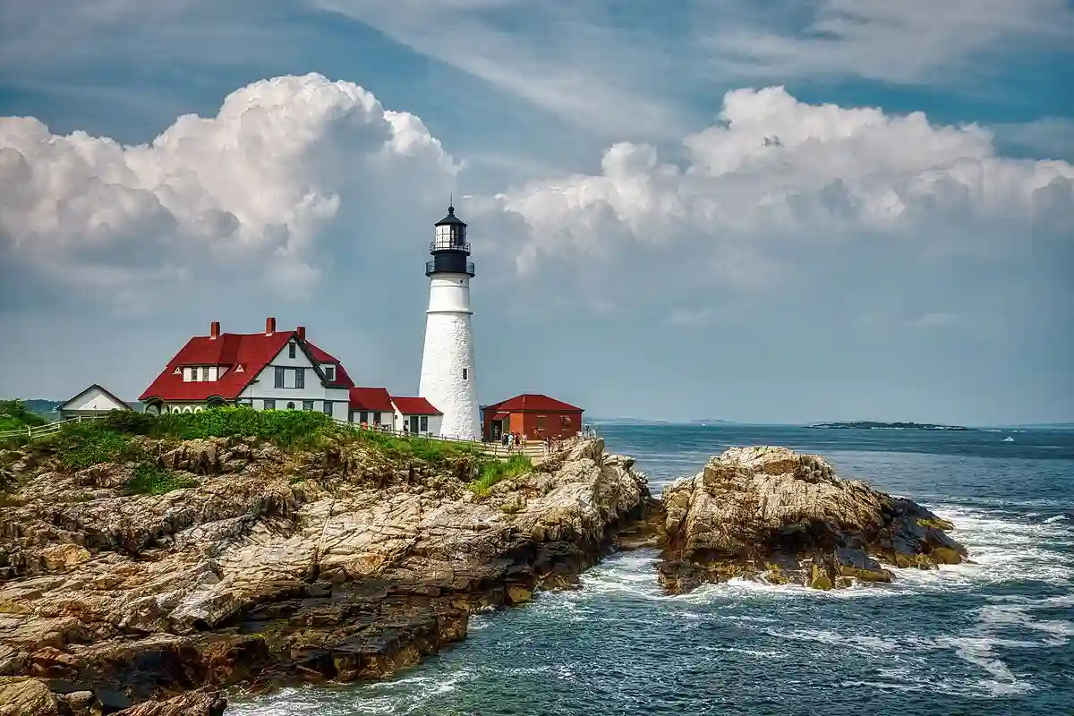 Iconic Portland Head Light lighthouse standing tall at the edge of Cape Elizabeth, Maine. Iconic Portland Head Light lighthouse standing tall at the edge of Cape Elizabeth, Maine.