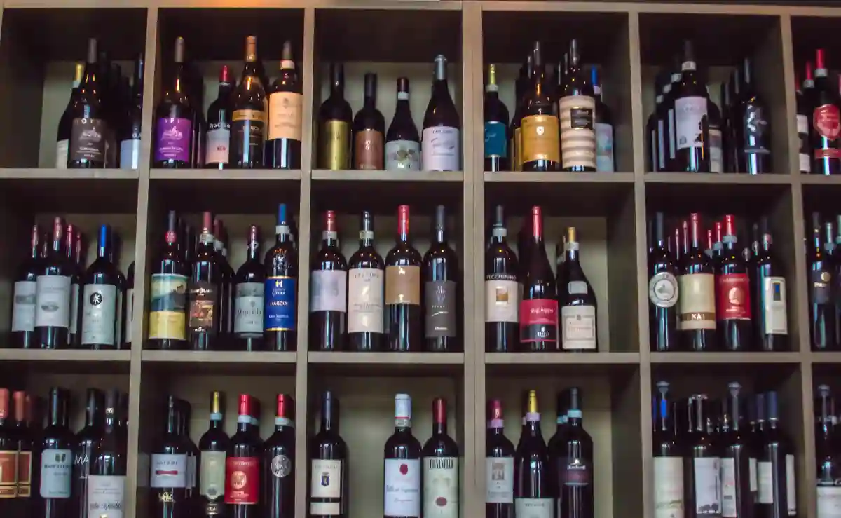 A selection of Italian wine bottles displayed on a shelf, showcasing Italy’s rich wine culture and renowned varieties. A selection of Italian wine bottles displayed on a shelf, showcasing Italy’s rich wine culture and renowned varieties.