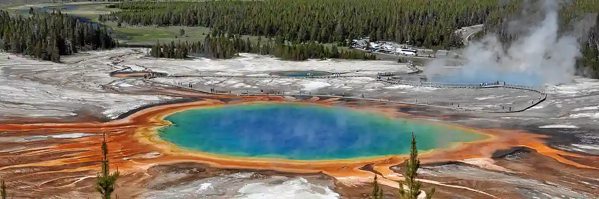 Vibrant geothermal features in Yellowstone National Park, with geysers and hot springs surrounded by vast natural beauty. Vibrant geothermal features in Yellowstone National Park, with geysers and hot springs surrounded by vast natural beauty.