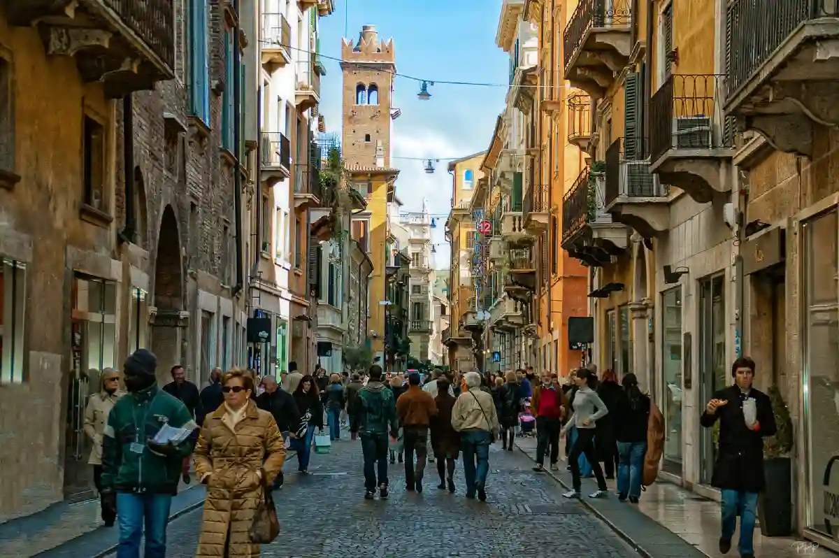 Tourists in Verona, admiring the city’s historic sites, including the Verona Arena and Juliet’s House. Tourists in Verona, admiring the city’s historic sites, including the Verona Arena and Juliet’s House.