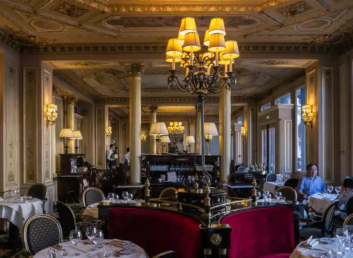 The elegant interior of Café de la Paix, one of the best breakfast places in Paris, showcasing grand décor, luxurious seating, and classic French pastries. The elegant interior of Café de la Paix, one of the best breakfast places in Paris, showcasing grand décor, luxurious seating, and classic French pastries.