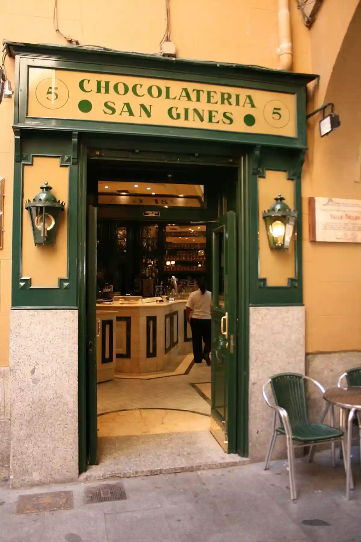 Inside view of ChocolaterĆa San GinĆ©s, one of the oldest and most iconic places to enjoy chocolate con churros in Madrid, with churros being served with rich, hot chocolate. Inside view of ChocolaterĆa San GinĆ©s, one of the oldest and most iconic places to enjoy chocolate con churros in Madrid, with churros being served with rich, hot chocolate.