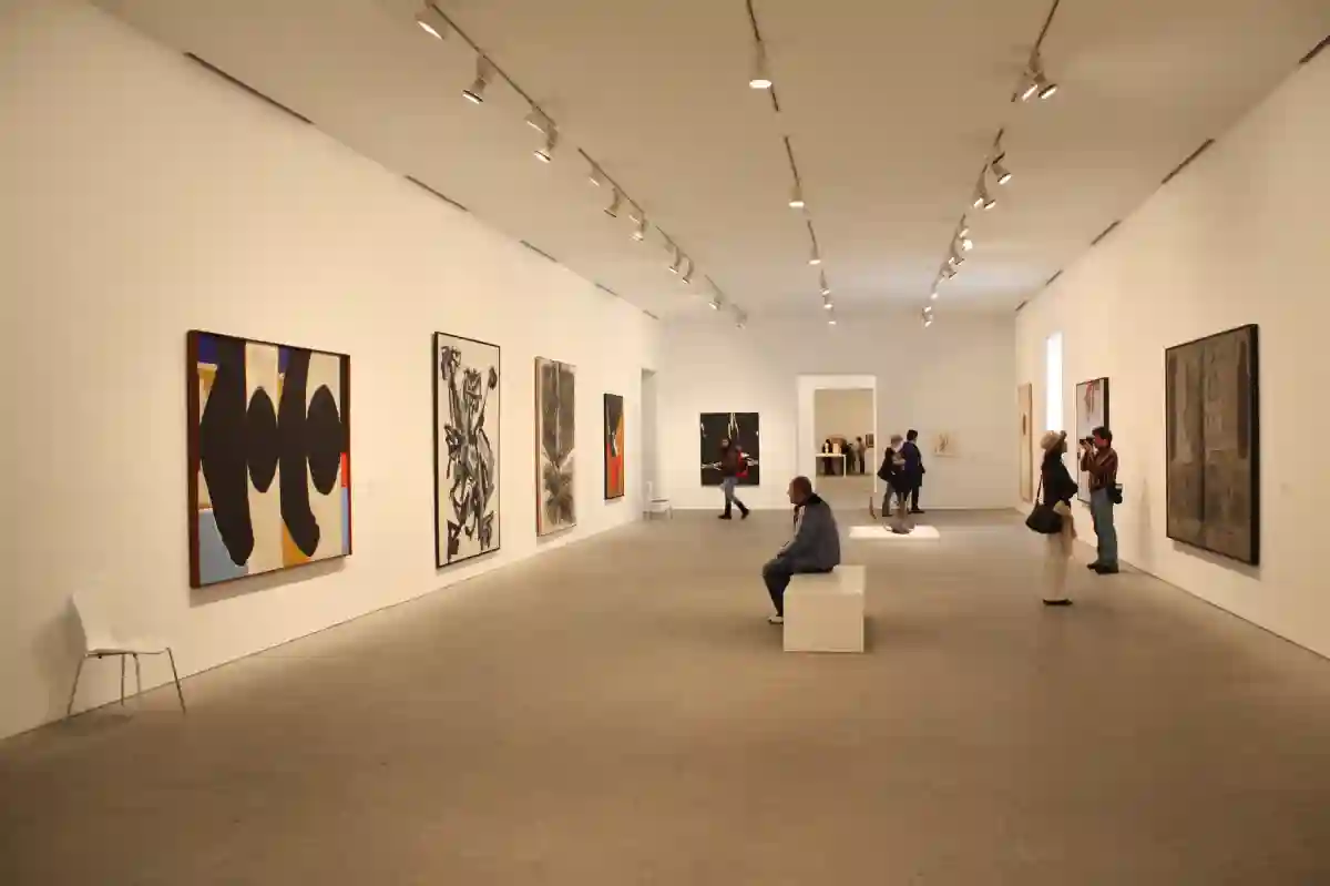 Interior view of Museo Reina Sofia in Madrid, showcasing contemporary art exhibits, sculptures, and vibrant installations. Interior view of Museo Reina Sofia in Madrid, showcasing contemporary art exhibits, sculptures, and vibrant installations.