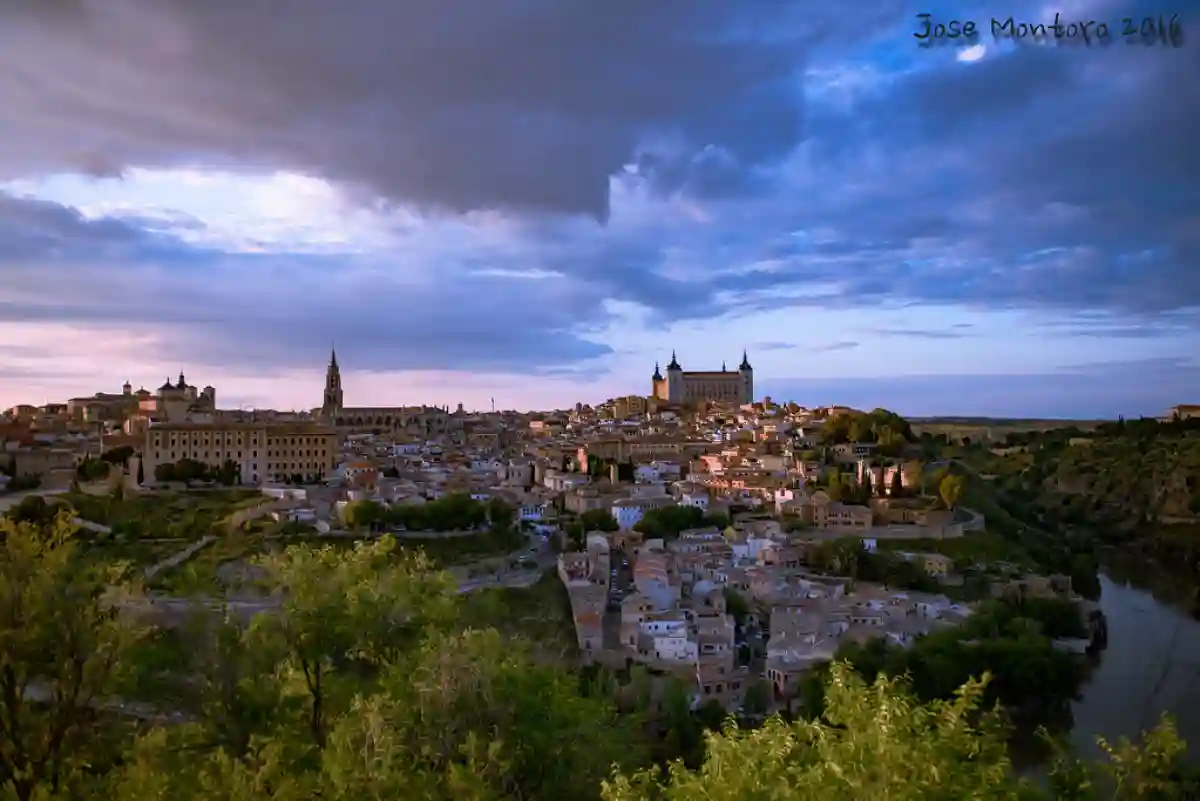 Panoramic view of Toledo, a UNESCO World Heritage city, featuring its ancient architecture, winding streets, and the stunning Toledo Cathedral. Panoramic view of Toledo, a UNESCO World Heritage city, featuring its ancient architecture, winding streets, and the stunning Toledo Cathedral.