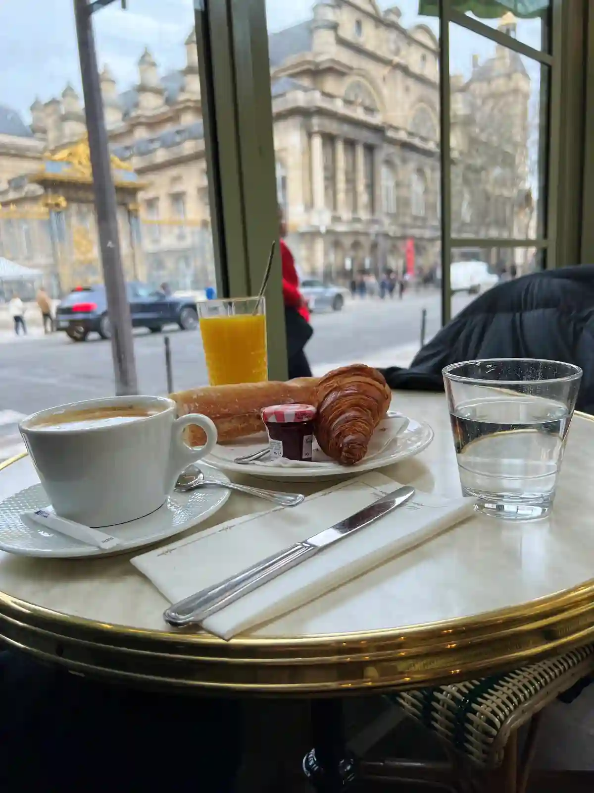 Enjoying breakfast near Sainte-Chapelle, a small Gothic church in the heart of Paris, known for its magnificent stained-glass windows, while savoring fresh croissants and coffee. Enjoying breakfast near Sainte-Chapelle, a small Gothic church in the heart of Paris, known for its magnificent stained-glass windows, while savoring fresh croissants and coffee.