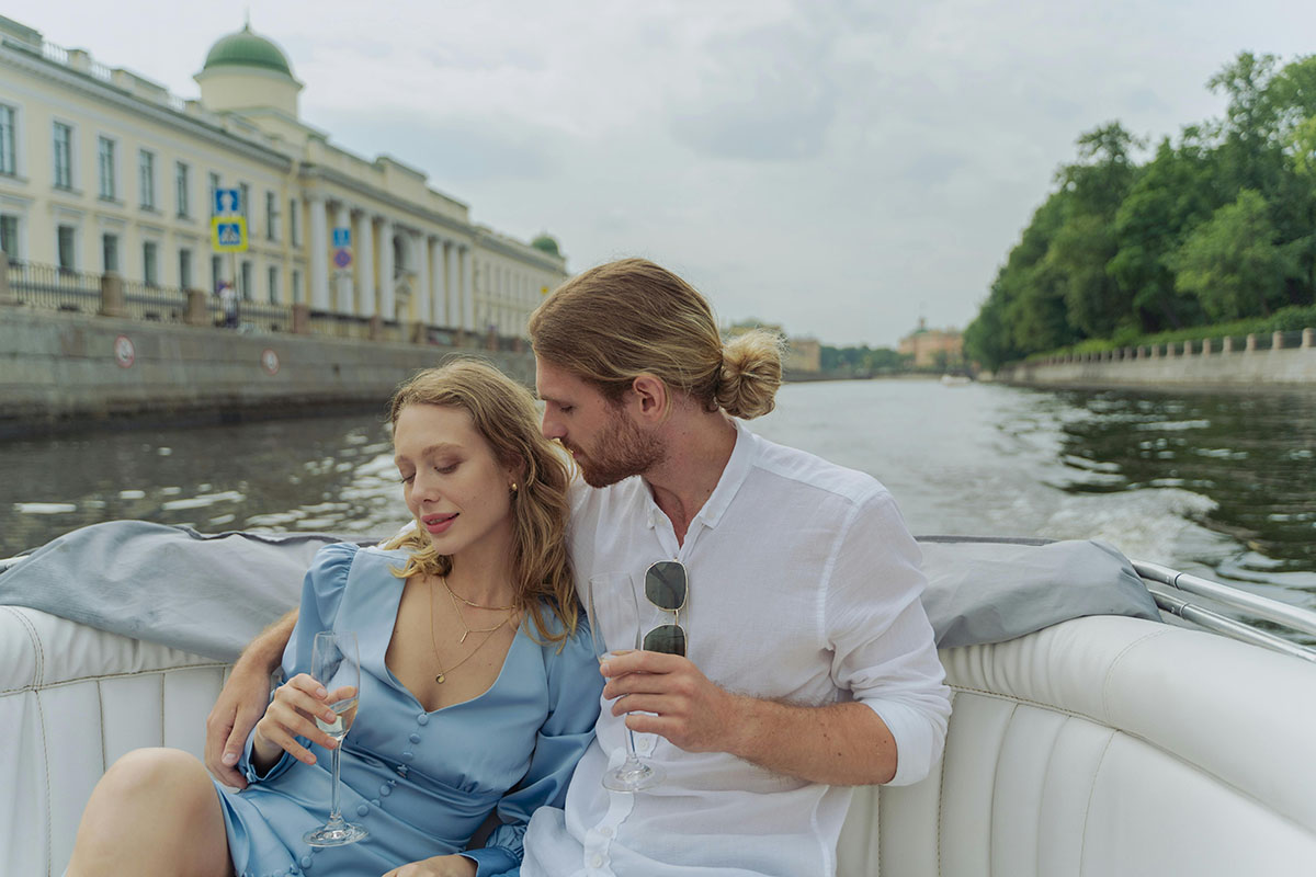 A Couple Riding on a Boat on the Neva River, Russia A Couple Riding on a Boat on the Neva River, Russia