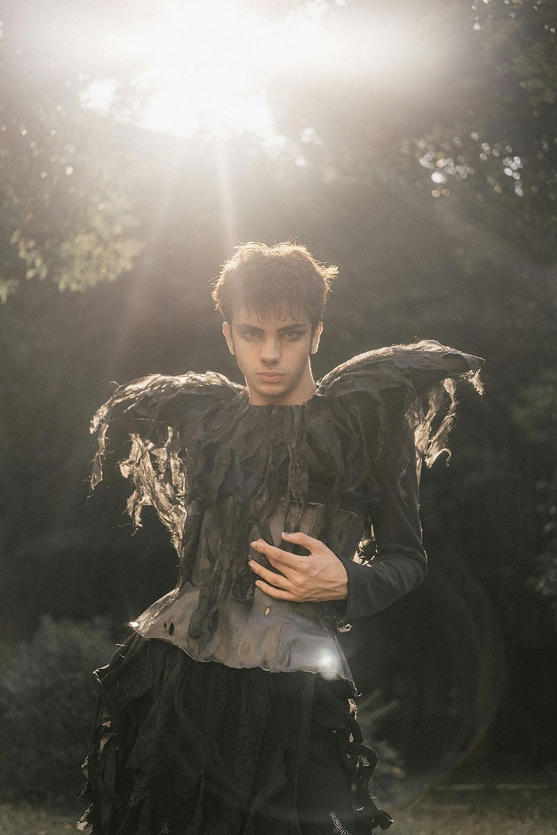 Dramatic Avant-Garde Fashion in Sunlit Forest Setting