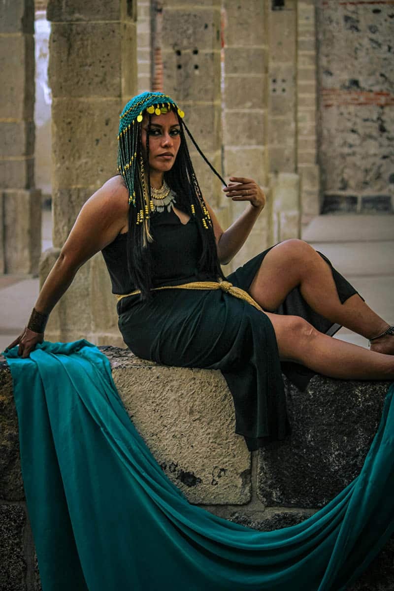 Woman in Black Dress Sitting on Wall Woman in Black Dress Sitting on Wall